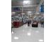 Wide aisle view of a store with shelves and shoppers at 6728 Sea Ranch Dr, Hudson, FL 34667