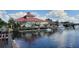Scenic waterfront property with a tiki hut and boat dock at 6728 Sea Ranch Dr, Hudson, FL 34667