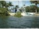 Charming waterfront property with a kayak and lush greenery at 6728 Sea Ranch Dr, Hudson, FL 34667