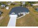 Aerial view of a new single-story house, two-car garage and landscaping at 3762 Wayward Ave, North Port, FL 34286