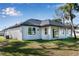 Rear view of house showcasing covered patio area at 3890 W Price Blvd, North Port, FL 34286