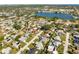 Wide aerial showcasing the neighborhood, nearby lake, and coastal views at 2594 60Th S Ave, St Petersburg, FL 33712