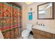 Bathroom with shower, toilet and wood vanity at 2594 60Th S Ave, St Petersburg, FL 33712