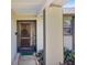 Home entryway with a wood door, screen door and walkway at 2594 60Th S Ave, St Petersburg, FL 33712