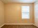 Simple bedroom with wood-look floors and window blinds at 4642 10Th S Ave, St Petersburg, FL 33711