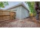 House exterior with wooden fence and a detached garage at 4642 10Th S Ave, St Petersburg, FL 33711