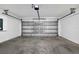 Attached garage with automatic opener and concrete floor at 13390 Banyan Rd, Spring Hill, FL 34609