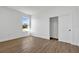 Simple bedroom with wood-look floors and closet at 14038 Cooper Rd, Spring Hill, FL 34609