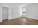 Bright bedroom featuring wood-look floors and a spacious closet at 14038 Cooper Rd Cooper Rd, Spring Hill, FL 34609