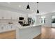 Modern kitchen with white cabinets, quartz countertops, and stainless steel appliances at 14038 Cooper Rd Cooper Rd, Spring Hill, FL 34609