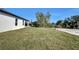 Spacious backyard with grassy area at 14038 Cooper Rd, Spring Hill, FL 34609