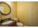 Powder room with granite vanity and decorative mirror at 5900 98Th N Ave, Pinellas Park, FL 33782