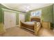 Comfortable bedroom with double doors and ceiling fan at 5900 98Th N Ave, Pinellas Park, FL 33782