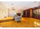 Game room with hardwood floors, fireplace, wet bar, and large screen TV at 5900 98Th N Ave, Pinellas Park, FL 33782