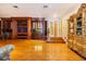 Game room with hardwood floors, built-in entertainment center, and staircase at 5900 98Th N Ave, Pinellas Park, FL 33782