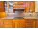 Well-equipped kitchen featuring granite counters and wood cabinets at 5900 98Th N Ave, Pinellas Park, FL 33782