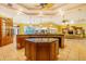 Island kitchen with granite countertops and wood cabinetry at 5900 98Th N Ave, Pinellas Park, FL 33782