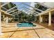 Beautiful in-ground pool with a spacious screened enclosure at 5900 98Th N Ave, Pinellas Park, FL 33782