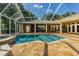 Inviting pool and spa with a covered patio and outdoor kitchen at 5900 98Th N Ave, Pinellas Park, FL 33782