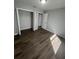 Bedroom with wood-look floors and a closet at 6336 Florida Cir, Apollo Beach, FL 33572