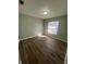 Bright bedroom featuring wood-look floors at 6336 Florida Cir, Apollo Beach, FL 33572