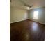 Bedroom with dark tile floors and ceiling fan at 6336 Florida Cir, Apollo Beach, FL 33572