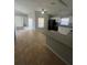 Open concept kitchen with granite counters and breakfast bar at 6336 Florida Cir, Apollo Beach, FL 33572