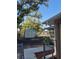 View of backyard with shed, fencing, and a screened enclosure under a clear blue sky at 21300 Washburn Ave, Port Charlotte, FL 33952