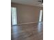 This bedroom features sleek wood floors and dual windows offering natural light at 21300 Washburn Ave, Port Charlotte, FL 33952