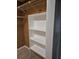 Walk-in closet with built-in shelving and ample storage space at 21300 Washburn Ave, Port Charlotte, FL 33952