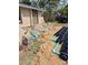 House with updated stone facade, septic system installation in progress in the front yard at 21300 Washburn Ave, Port Charlotte, FL 33952