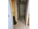 Hallway with multiple doorways including access to storage shelves at 21300 Washburn Ave, Port Charlotte, FL 33952