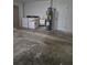 Laundry area in garage has washer, dryer, and water heater near a door at 21300 Washburn Ave, Port Charlotte, FL 33952