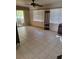 Bright living room featuring neutral walls, tile floors, and access to an outdoor patio at 21300 Washburn Ave, Port Charlotte, FL 33952