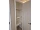 A well-organized pantry with shelves provides ample storage space for kitchen essentials at 21300 Washburn Ave, Port Charlotte, FL 33952