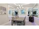 Bright dining room with a wood table and statement art at 6250 Grandview Hill Ct, Bradenton, FL 34203