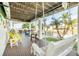 Relaxing back porch with seating and waterfront views at 4049 Cobia Dr, Hernando Beach, FL 34607
