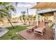 Relaxing backyard with patio, lounge chairs, and hammock at 4049 Cobia Dr, Hernando Beach, FL 34607