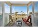 Private balcony overlooking a tranquil waterway with comfortable seating at 4049 Cobia Dr, Hernando Beach, FL 34607