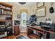 Functional home office with built-in shelves and desk at 4049 Cobia Dr, Hernando Beach, FL 34607