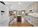 Bright kitchen with granite countertops, white cabinets, and stainless steel appliances at 4049 Cobia Dr, Hernando Beach, FL 34607