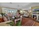 Spacious living room with hardwood floors, fireplace, and comfortable seating at 4049 Cobia Dr, Hernando Beach, FL 34607