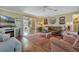 Cozy living room with hardwood floors, fireplace, and comfortable furniture at 4049 Cobia Dr, Hernando Beach, FL 34607