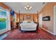 Large main bedroom with a king-size bed and fireplace at 4049 Cobia Dr, Hernando Beach, FL 34607