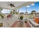 Spacious screened porch overlooking the water, furnished with seating at 4049 Cobia Dr, Hernando Beach, FL 34607