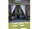 Rustic barn with large white curtains and stone pathway entrance at 15625 State Road 62 St, Parrish, FL 34219