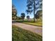Brick driveway lined with trees and leading to the property at 15625 State Road 62 St, Parrish, FL 34219