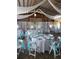 Rustic-chic barn venue decorated in light blue and silver at 15625 State Road 62 St, Parrish, FL 34219