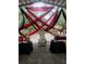 Royal throne with red and black drapes for a luxurious event space at 15625 State Road 62 St, Parrish, FL 34219