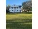 Two story home with white columns and a lush lawn at 15625 State Road 62 St, Parrish, FL 34219